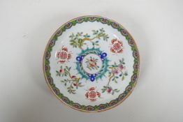 An early C20th Chinese famille verte porcelain dish decorated with bats, auspicious symbols and