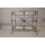 A Victorian brass firescreen, with applied patarae and harebell decoration, 30" x 28"