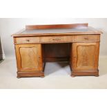 A good quality Swedish mahogany twin pedestal desk with inset leather writing surface over three