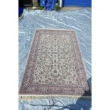 A fine woven beige ground full pile Iranian carpet with an all over floral pattern, 118" x 78"