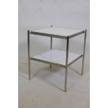 A late C20th brushed aluminium two tier occasional table, inscribed to base reg design. 919338,