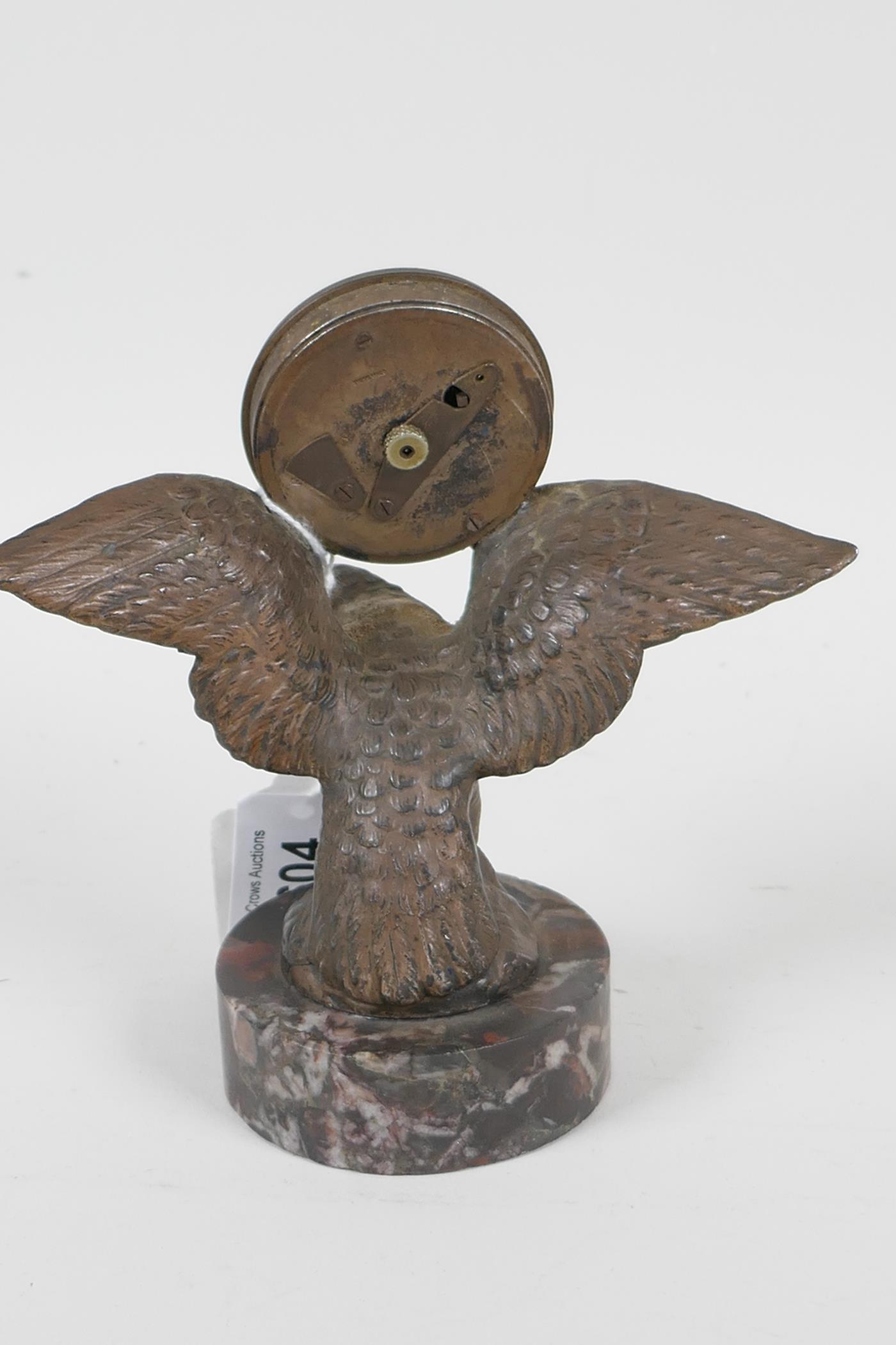 A desk clock cast as an eagle with spread wings, mounted on a marble plinth, 5" high - Image 4 of 4