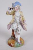 A Continental porcelain figure of a dandy with tricorn hat and spyglass, 5½" high