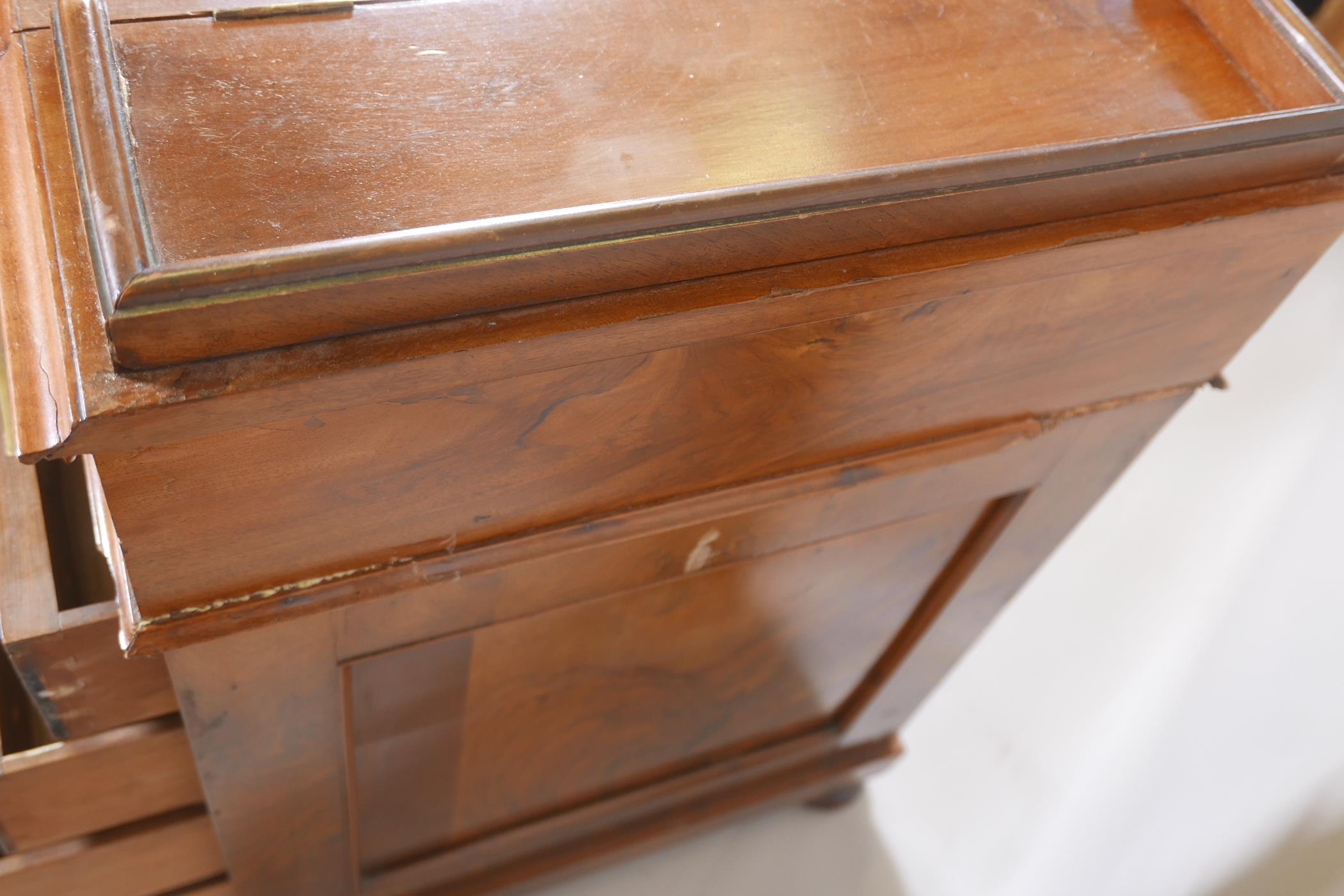 A Victorian figured walnut davenport with carved piano legs, tooled leather inset top and fitted - Image 9 of 9