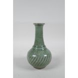 A Chinese celadon glazed porcelain vase with ribbed spiral decoration to the body, 6½" high