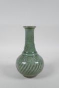 A Chinese celadon glazed porcelain vase with ribbed spiral decoration to the body, 6½" high