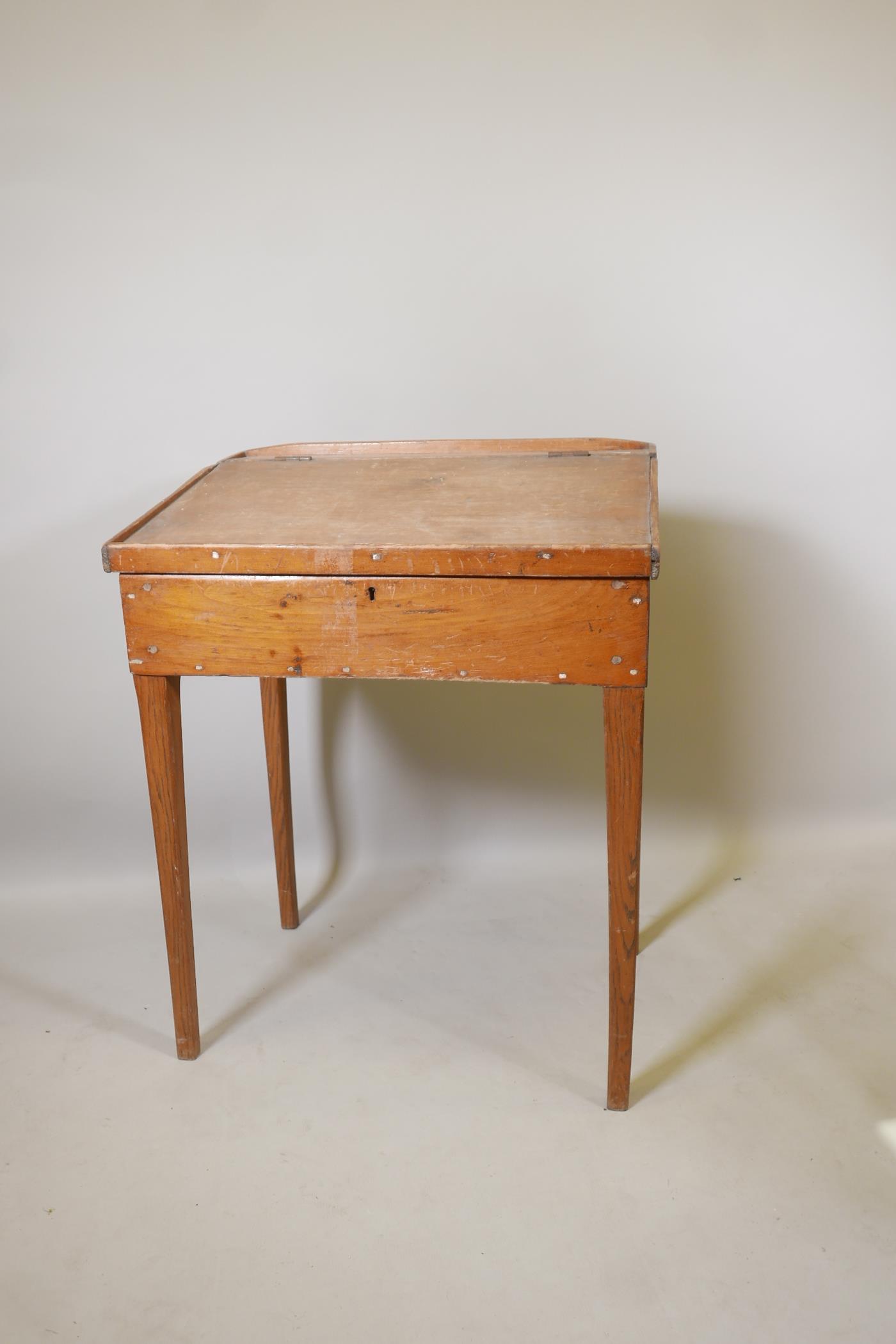 A C19th pine clerk's desk, raised on square tapering supports, 29" x 22" x 37" - Image 2 of 2