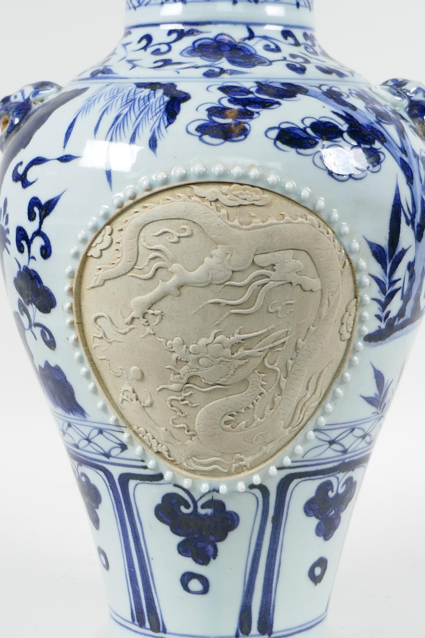 A Chinese blue and white porcelain vase with two lion mask handles, chased decorative panels - Image 5 of 8