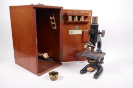A Baker of London '9573' microscope, cased, 12" high