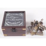 A replica brass travelling sextant in a hardwood case, 4½" square