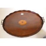 A Georgian mahogany oval tray with shaped gallery and shell inlay, 25" x 18"