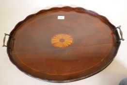 A Georgian mahogany oval tray with shaped gallery and shell inlay, 25" x 18"