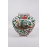 A Chinese wucai porcelain jar with phoenix decoration, 8½" high