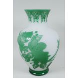 A Peking glass vase with cut green overlay over white, depicting butterflies and flowering branches,