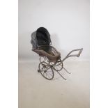 A Victorian wood framed and cane child's pram, 38" x 15" x 35" high