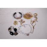 A collection of assorted costume jewellery to include bangles, brooches, necklaces etc