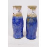 A pair of Royal Doulton stoneware vases with drip glazed blue body and banded necks, with applied