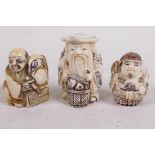 Three carved bone netsuke, of an artist and two standing figures, largest 2"