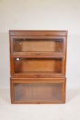 An oak three section Globe Wernicke style bookcase, incomplete, 34" wide, largest section 15½" x 12"