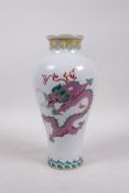 A polychrome porcelain vase decorated with iron red and pink dragons, Chinese Qianlong seal mark