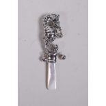 A sterling silver baby's rattle in the form of a seahorse, with a mother of pearl style handle,