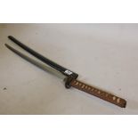 An antique Japanese sword, probably C17th, with later shagreen handle, brass menuki and iron
