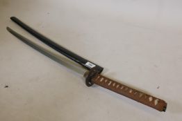 An antique Japanese sword, probably C17th, with later shagreen handle, brass menuki and iron