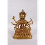 A Tibetan gilt bronze of a many armed deity, double vajra mark to base, 9" high