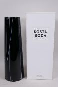 A tall Swedish Kosta Boda tapered cylindrical vase with white cut decoration on a black body, 13"