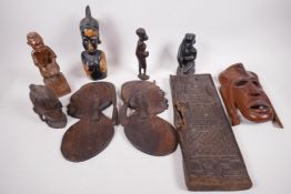 A collection of African carved wood figures and masks etc, including a Benin carved panel, A/F,