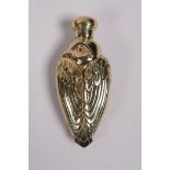 An 18ct gold plated scent bottle in the form of a bird, 3" long