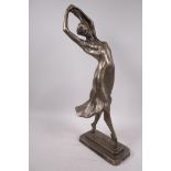 An Austin Products composition figure of a dancing girl, signed Muci, 20" high