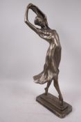 An Austin Products composition figure of a dancing girl, signed Muci, 20" high