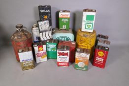 Twelve oil cans, 1 gallon each, various suppliers, together with four larger containers and a petrol