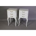 A pair of bow fronted painted bedside chests with three drawers, raised on shaped supports, 14" x