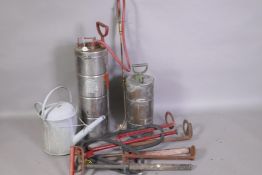 Four vintage Stirrups pumps, two crop sprayers and a watering can