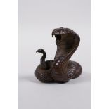 A Japanese Jizai style bronzed metal cobra, 2" high