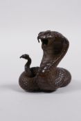 A Japanese Jizai style bronzed metal cobra, 2" high