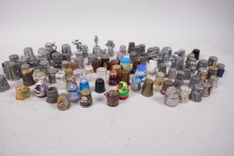 A quantity of thimbles including Millefiori glass, cloisonne, painted wood, pewter etc,