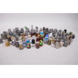 A quantity of thimbles including Millefiori glass, cloisonne, painted wood, pewter etc,