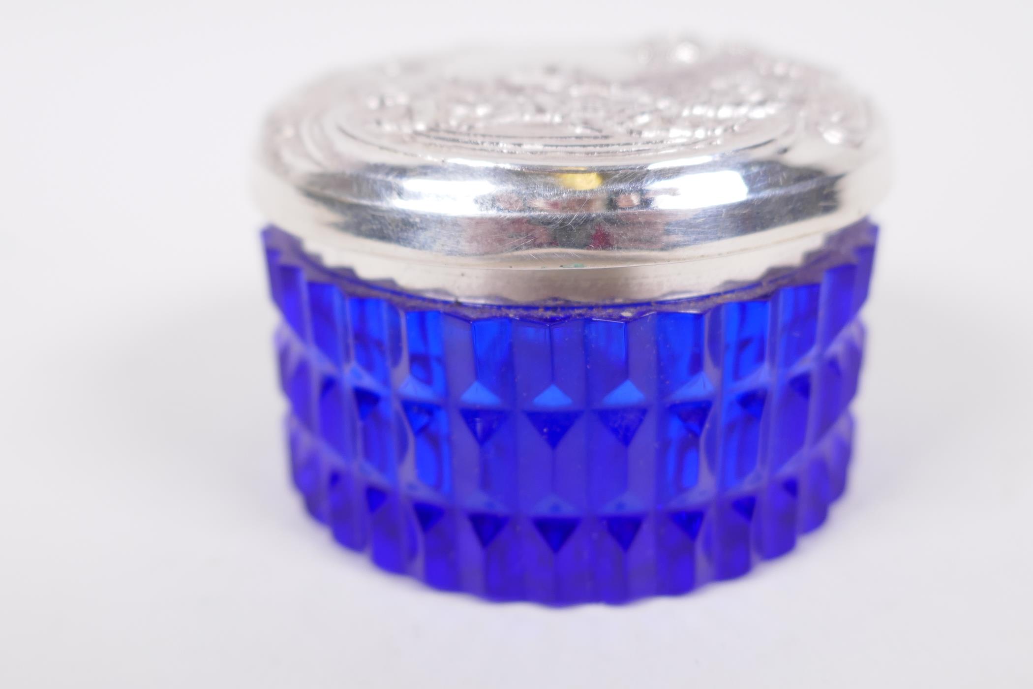 A circular sterling silver lidded blue glass trinket box, the lid embossed in the Art Nouveau style, - Image 3 of 3
