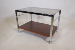 An MDA chrome, faux rosewood and smoked glass tea trolley by Howard-Miller Ltd, 24" x 16½", 16½"