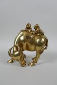 A Chinese gilt bronze of two boys riding a buffalo, 5½" high