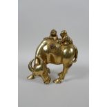 A Chinese gilt bronze of two boys riding a buffalo, 5½" high