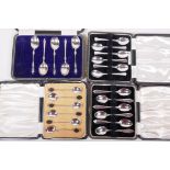 A boxed collection of hallmarked silver to include two sets of six teaspoons, one set of coffee bean
