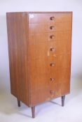 A mid C20th tallboy chest of seven drawers, by Meredew, 47" x 24" x 18"
