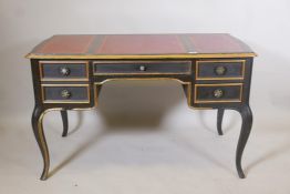 A French style ebonised and parcel gilt five drawer desk, with gilt tooled leather inset top, raised