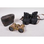 A cased pair of brass and mother of pearl opera glasses, and a pair of compact WWII field glasses,