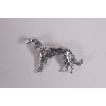 A sterling silver brooch in the form of a dog, 1"