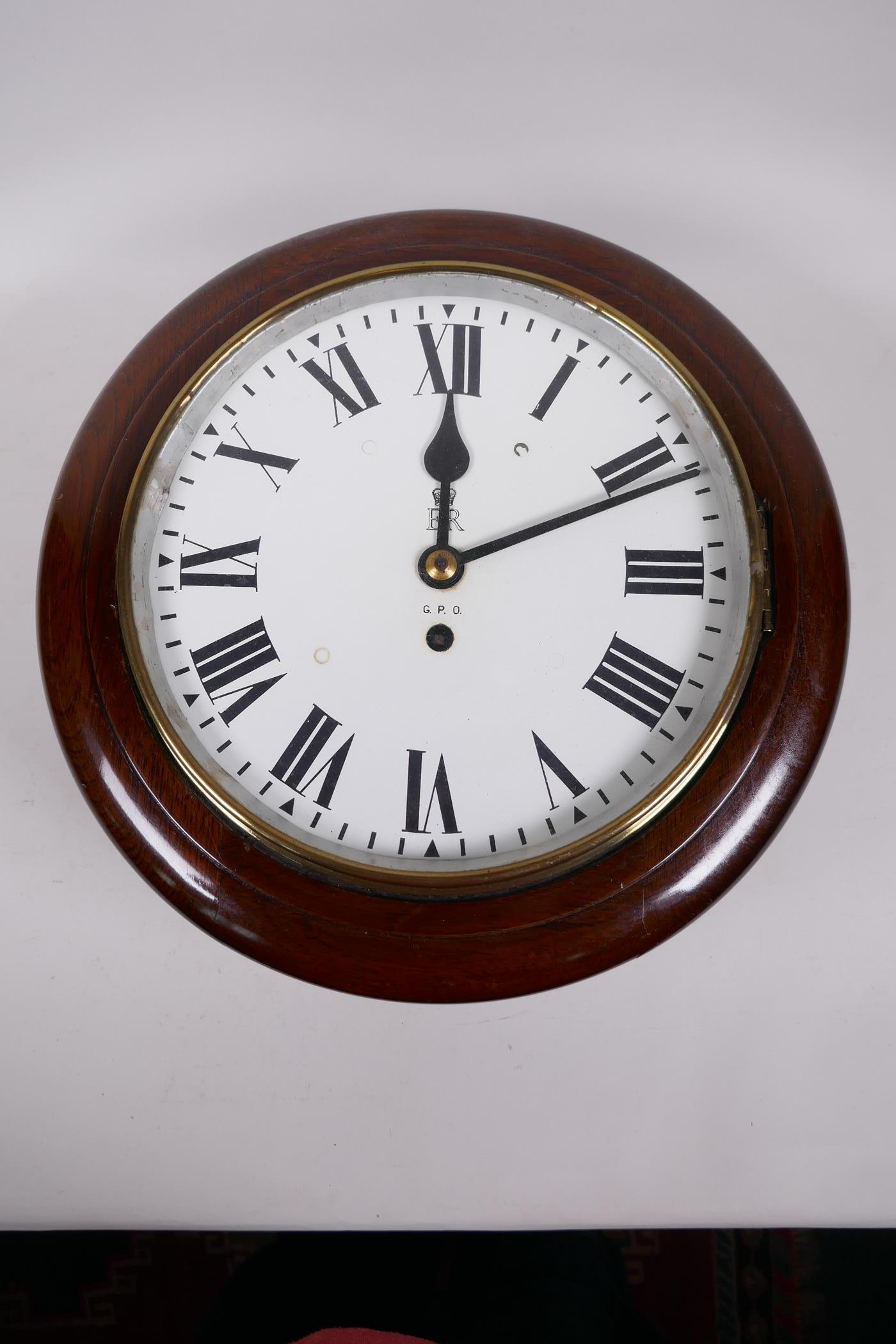 A C20th circular wall clock with single train fusee movement, the dial with Royal ER crest and